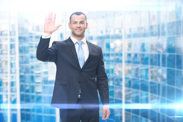 Portrait of businessman waving hand