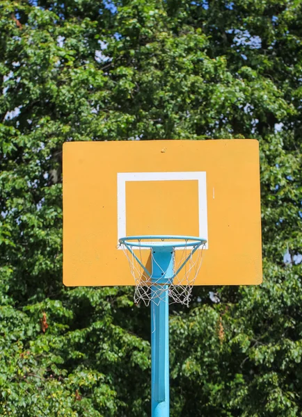 Yellow basketball backboard with ring