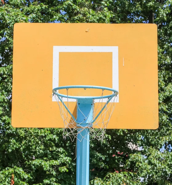 Yellow basketball backboard with ring