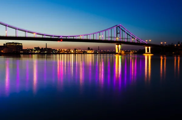 Night landscape with a bridge in the city of Kyiv
