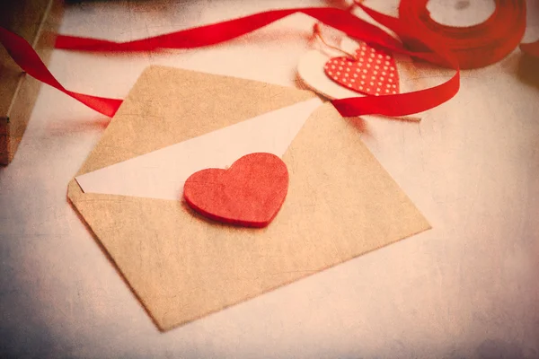 Envelope with heart lying on the table