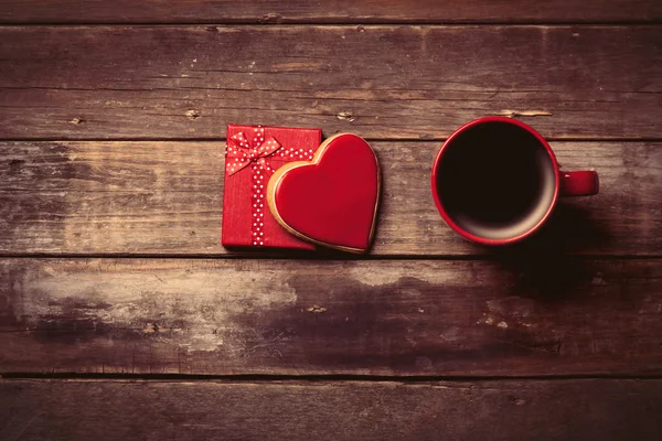 Cup of coffee, gift and cookie in the box