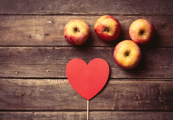 Apples and heart shaped toy