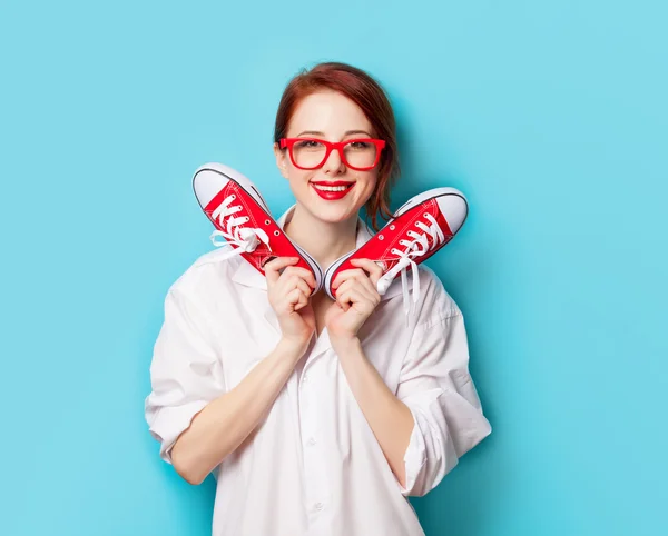 Girl in white shirt with gumshoes