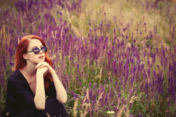 Girl with sunglasses on lavender field.