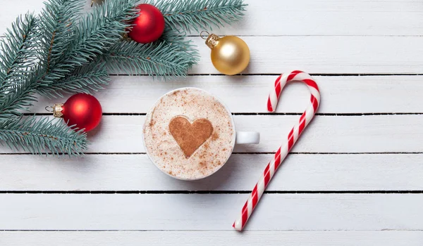Cup of coffee and christmas gifts