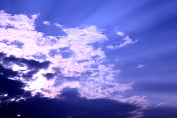 Beautiful white clouds under the light of the Sun