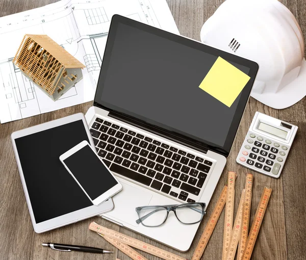 Wood architect's desk in high definition with laptop, tablet and