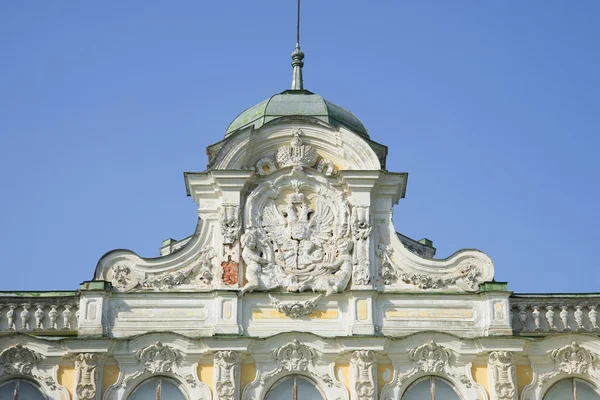 Russian coat of arms on the pediment of the Imperial Palace in farmstead \