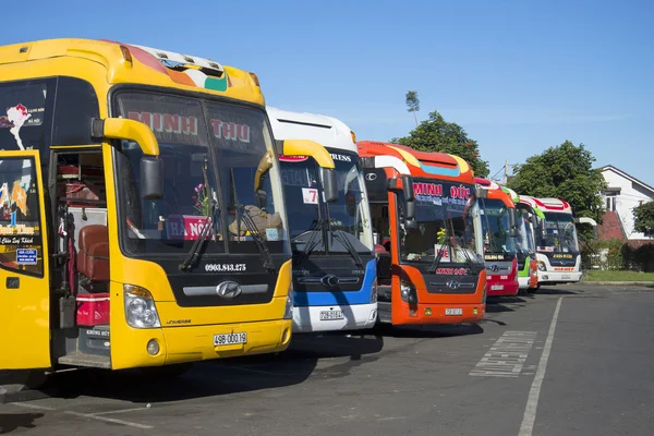 Colorful long-distance buses are at the bus station of Da Lat before