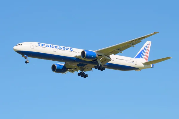 The Boeing 777-312 (EI-UNM) of the company Transaero before landing in Pulkovo airport