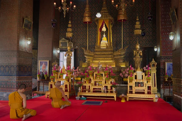 Buddhist monks pray in vihane Wat Thepthidaram Worawihan. Bangkok