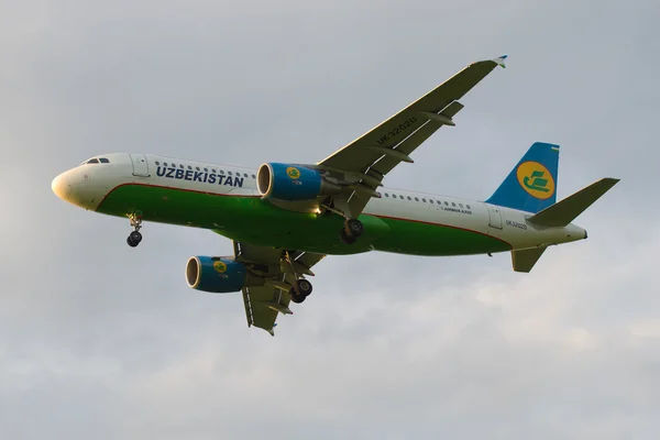Airbus A320-214 (UK-32020) of the company Uzbekistan Airways in cloudy sky