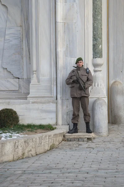 A Turkish soldier is guarding the Topkapi Palace. Istanbul, Turkey