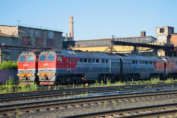Two mainline freight diesel locomotive 2TE116 on in the locomotive depot station Rybinsk