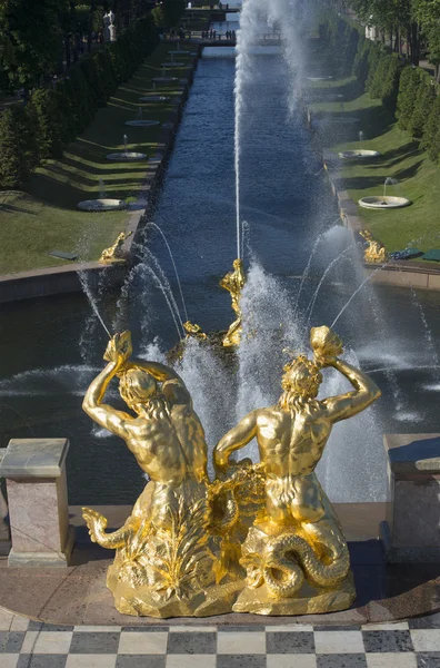 Two Triton trumpeting in the shell over the Big sea channel. A fragment of the Grand cascade, Peterhof