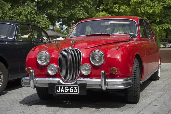 Red Jaguar Mk.-1 party parade of vintage cars. Turku, Finland