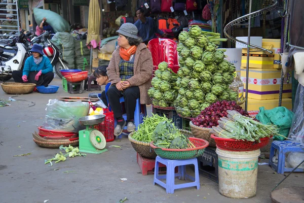 Woman selling artichokes at the Central market of Dalat. Vietnam