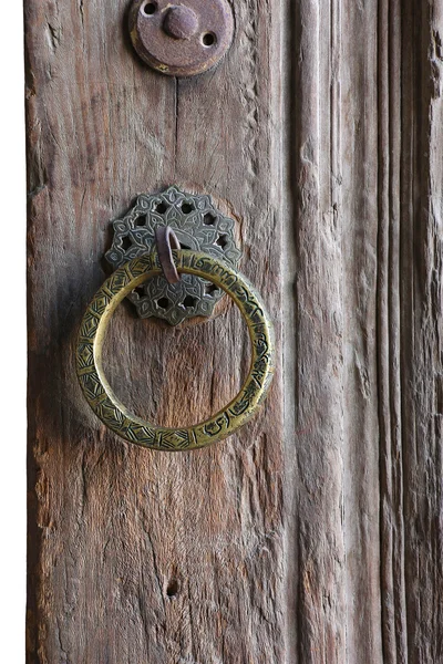 Round door handle with an arabic inscription, the old wooden doo