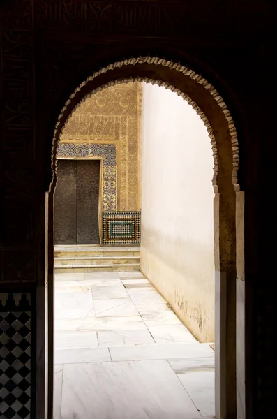 Arch door in ancient Arabian palace Alhambra. Granada, Spain