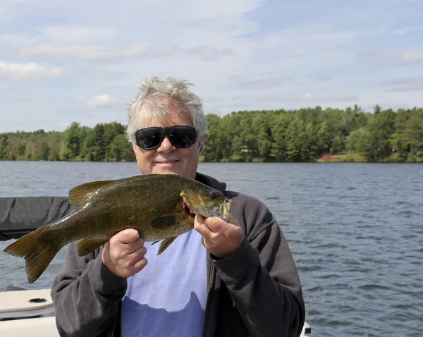 Fisherman with a Small Mouth Bass