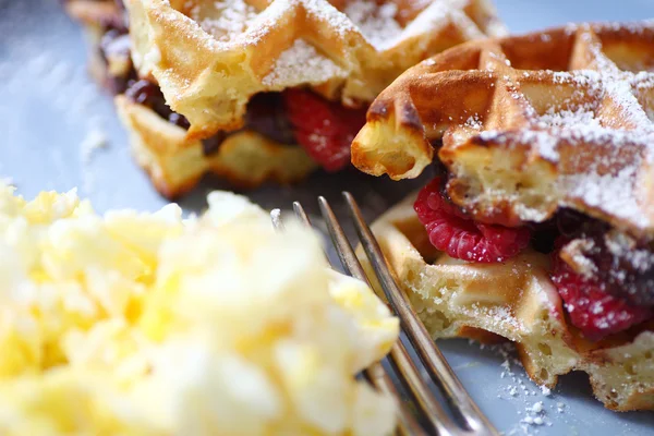 Breakfast eggs with fruit-stuffed waffles