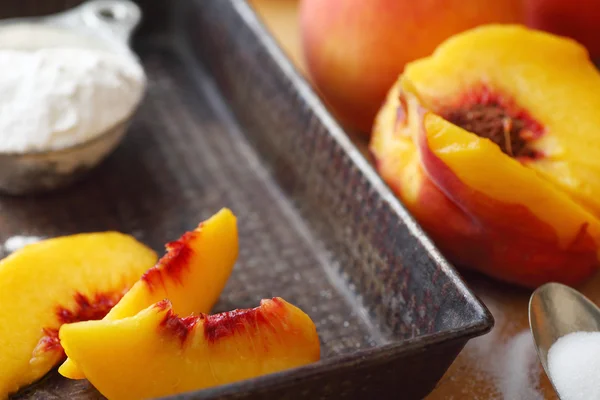 Sliced peaches in old pan