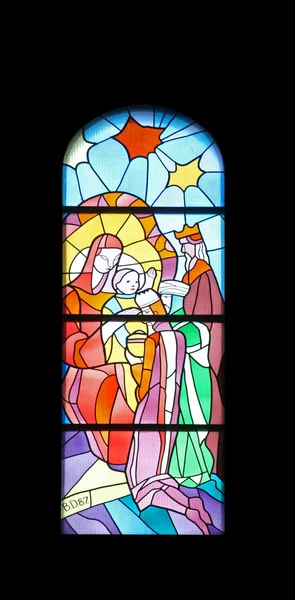 Nativity Scene, Adoration of the Magi, stained glass church window in the parish church of St. James in Medugorje