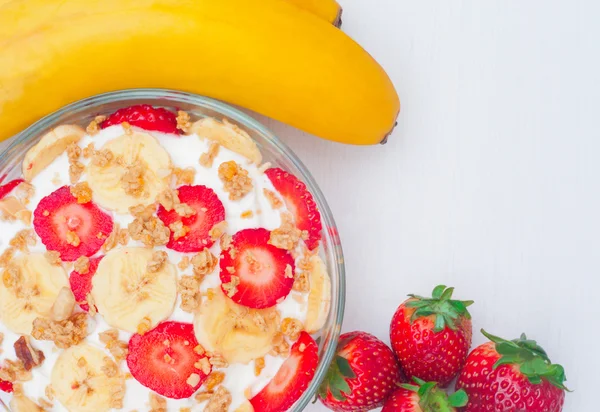 Greek yogurt with muesli, strawberries and banana