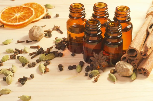 Essential oils in glass bottles and spices