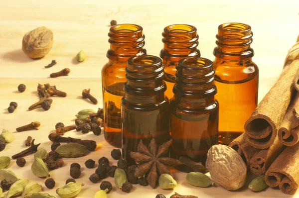 Essential oils in glass bottles and spices