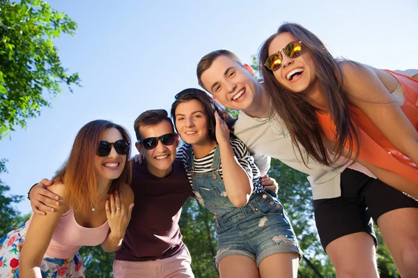 Happy friendship concept with young people having fun together