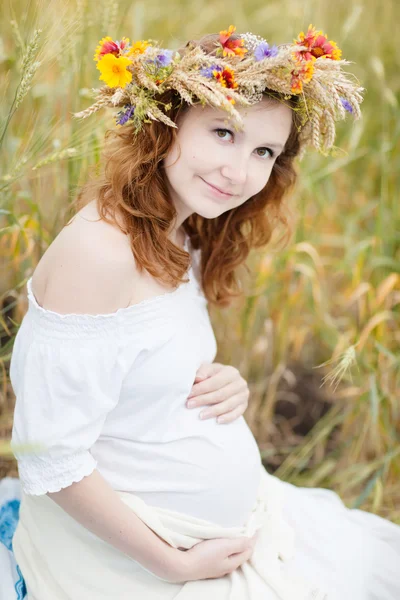 Beautiful woman with flower wreath