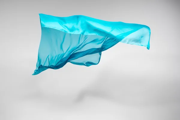 Abstract teal fabric in motion