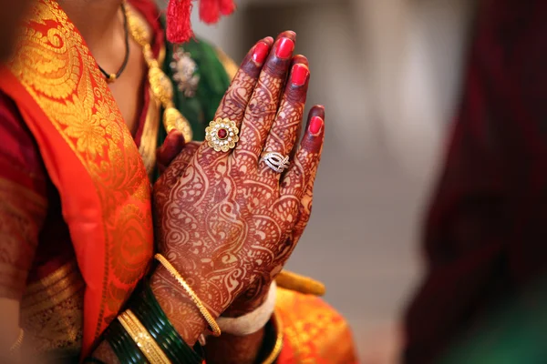 Indian bride praying during her wedding.