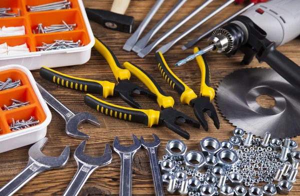 Working tools on wooden background