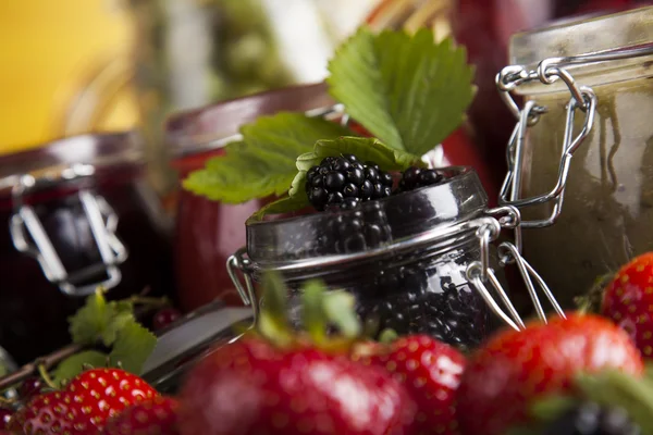 Homemade fruit jam in the glass jars