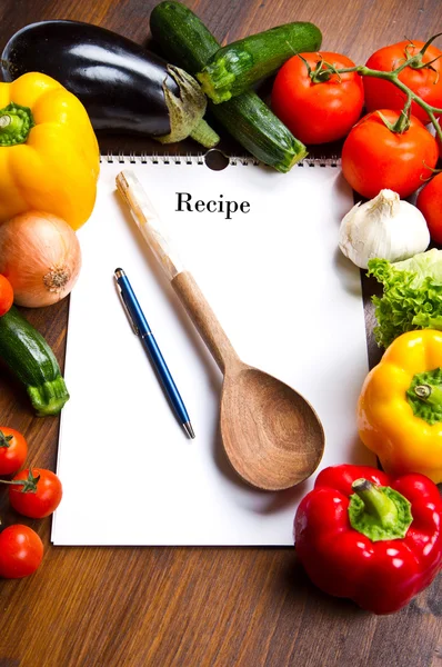 Blank recipe book and food ingredients