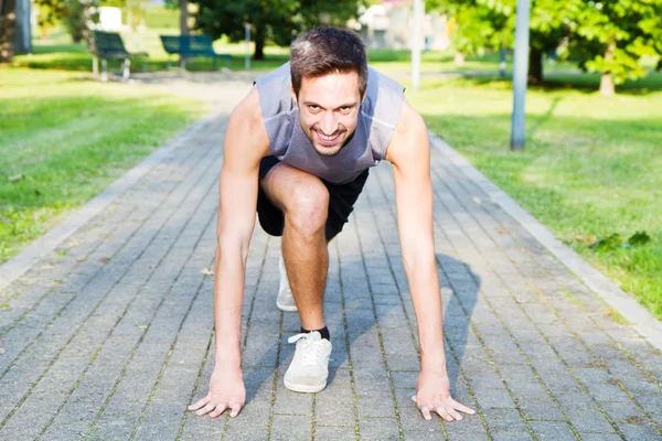 Handsome Athletic Man in Running Start Position