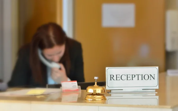 Hotel reception desk with bell