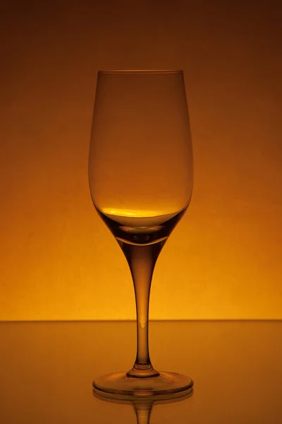 Empty wine glass studio light yellow shot 5