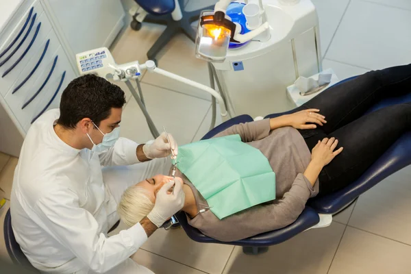Top view of caucasian dentist doing his job