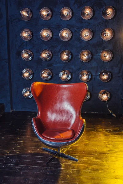Red leather chair in the interior of the Studio. The concept of a job for creative element - music producer, Director, photographer, presenter