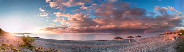 Camping with many tents on the beach at the seaside. Panorama Of Abkhazia, New Athos