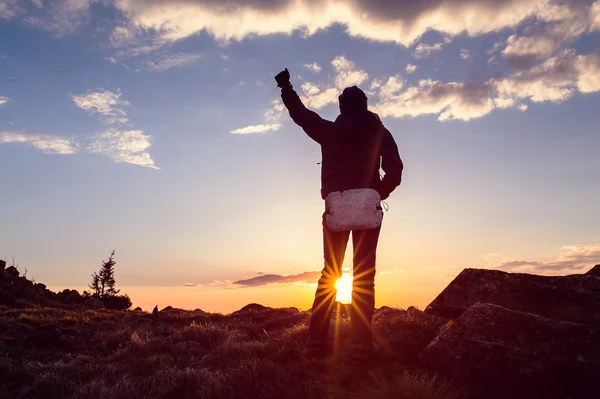 Life goals concept. Woman holding his fist in the air against a