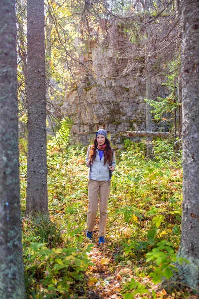 Hiker woman. Hiking portrait of happy young female hiker smiling