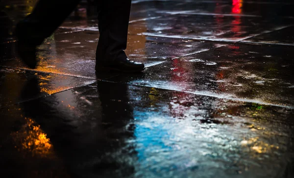 NYC streets after rain with reflections on wet asphalt