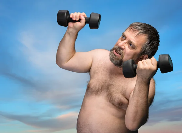 Man exercising with dumbbells