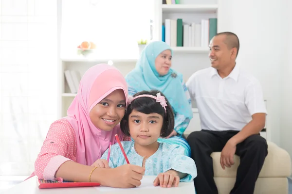 Malay family learning together