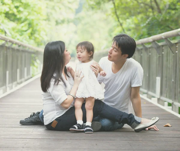 Asian family in park